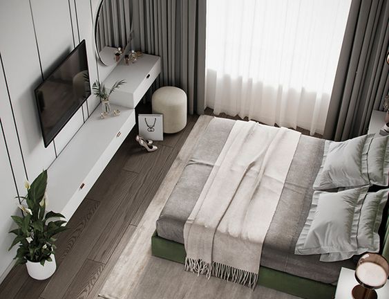 Как оформить зону для телевизора в маленькой спальне?